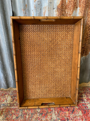 A faux bamboo butler's tray table