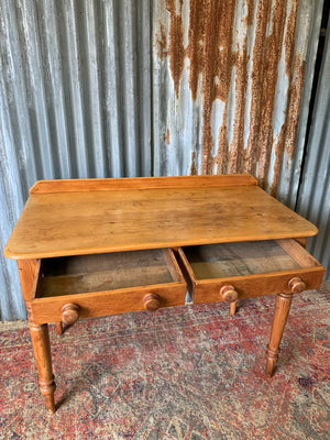 A pine two-drawer desk