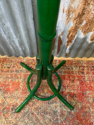 A tall bentwood coat stand with hat rack