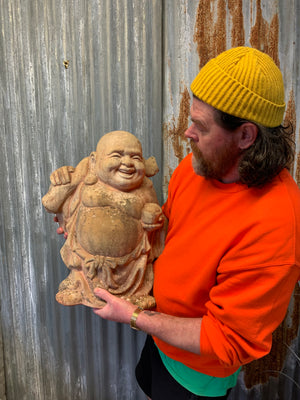 A large terracotta buddha statue