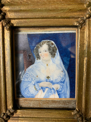 A framed miniature of a woman in blue ~ front view