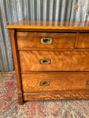 A satinwood chest of drawers