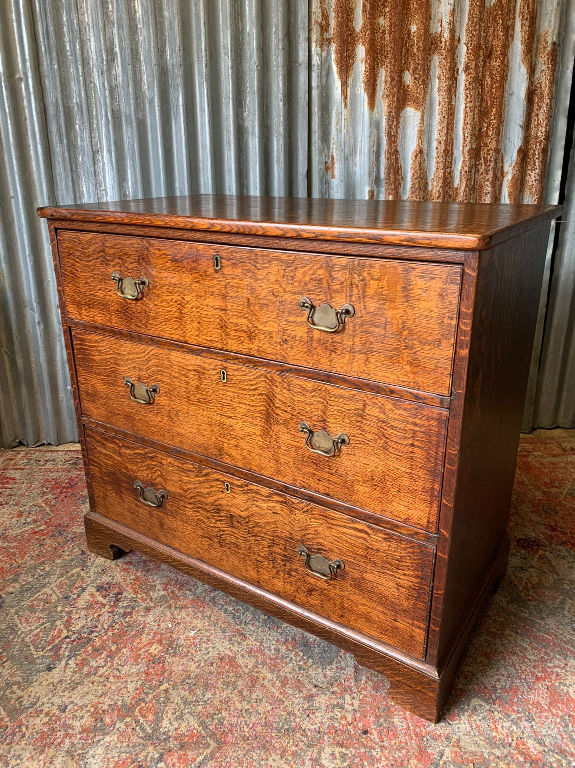 A Georgian style oak chest of drawers