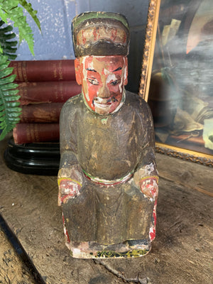 A hand carved Taoist figure