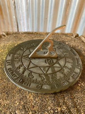 A large cast stone sundial