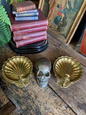 A pair of large brass shell candlestick wall sconces