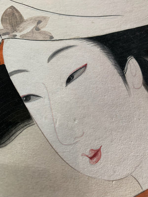 A Japanese ukiyo-e framed painting of a geisha