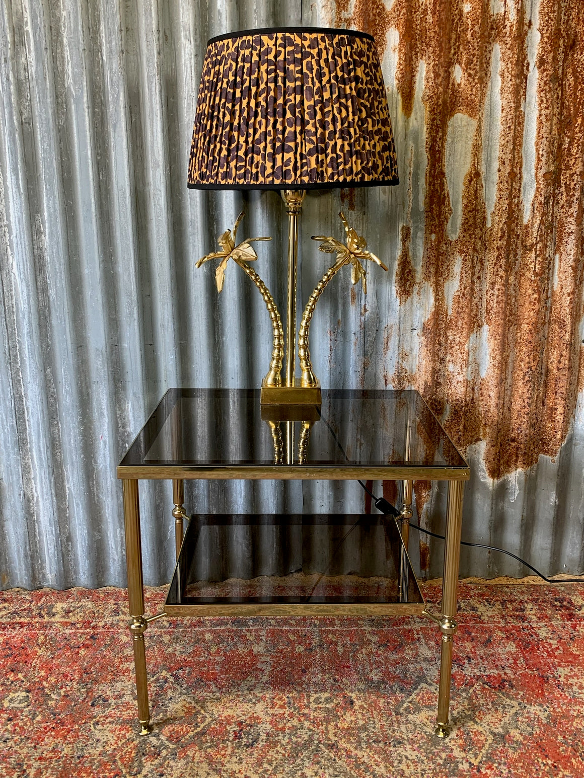 A Hollywood Regency two tier side table