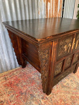 A carved wooden Chinese altar cabinet