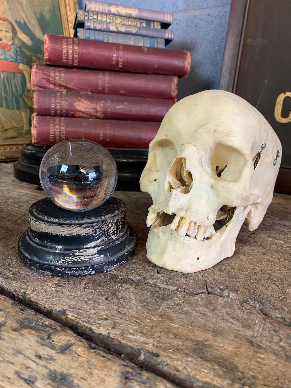 A Victorian crystal ball with box and stand