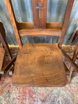 An Edwardian oak folding chapel chair by Mealing Bros