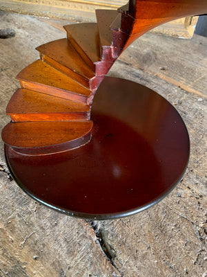A wooden spiral staircase model