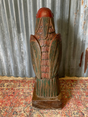 A very large carved wooden polychrome parrot statue