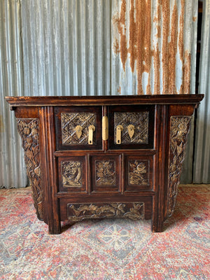 A carved wooden Chinese altar cabinet