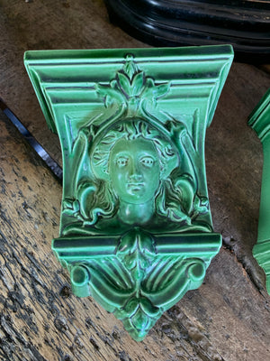 A pair of neoclassical ceramic wall pockets