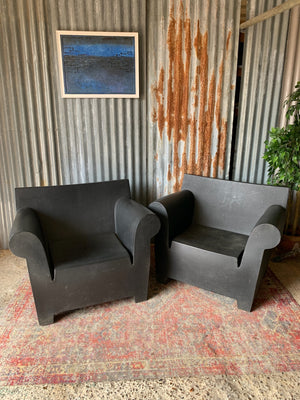 A pair of black Bubble Club garden chairs by Kartell