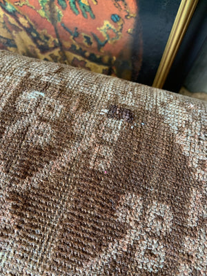 A large Persian carpet footstool