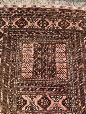 A Persian brown ground rectangular rug- 243cm x 166cm