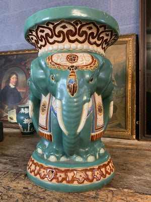 A large ceramic elephant head jardiniere