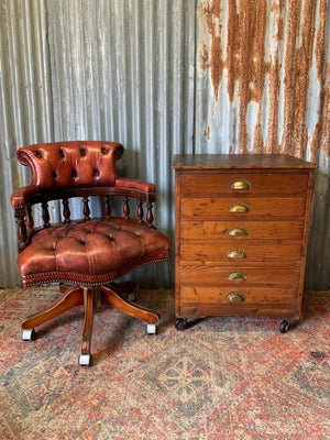 A pine chest of six drawers on castors