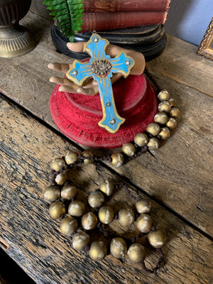 A set of oversized wooden rosary beads with eye motif