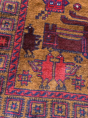 A Persian or Kurdish red ground pictorial rug - 165cm x 92cm