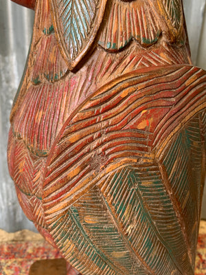 A very large carved wooden polychrome parrot statue