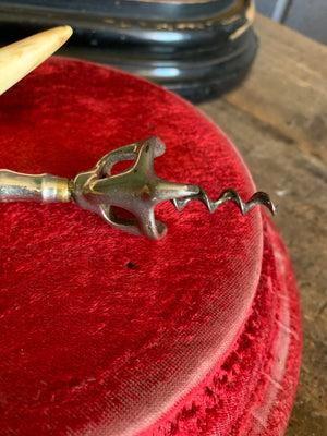 An Edwin Walker bell corkscrew with boar tusk handle