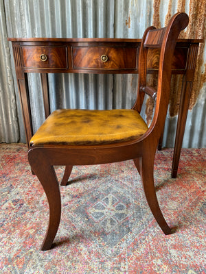 A serpentine desk and leather chair by Bevan Funnell