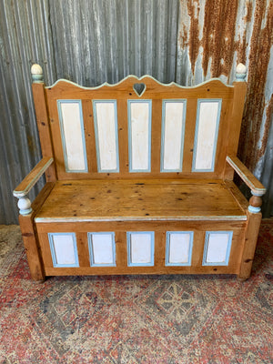 A pine storage settle