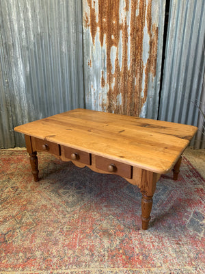 A large pine coffee table