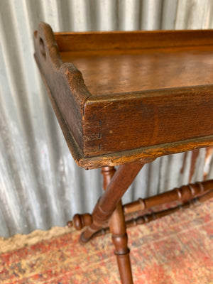 An oak butler's tray table