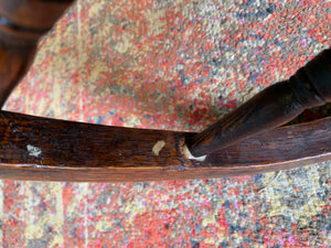 An oak spindle back captain's chair