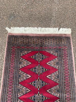 A long pink ground Persian runner rug ~ 318cm x 83cm