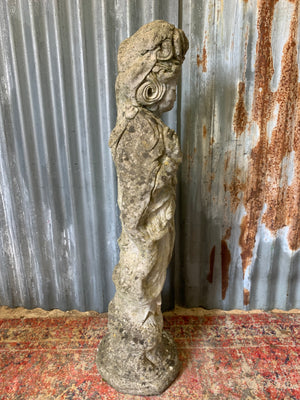 A cast stone garden statue of Guanyin