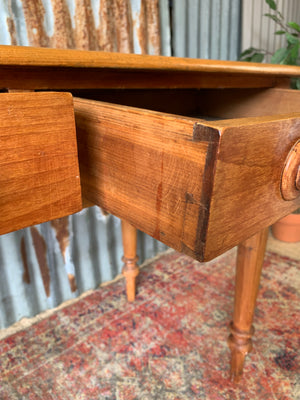 A pine two-drawer desk