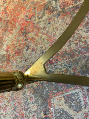 A rare circular brass and glass Hollywood Regency coffee table