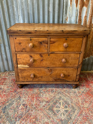 A pine chest of two over two drawers