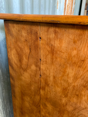 A satinwood chest of drawers