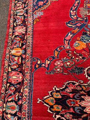 A very large rectangular red ground Persian floral rug ~ 12ft x 8ft