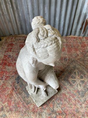 A pair of cast stone Pandora statues