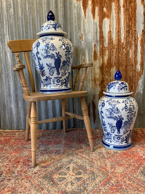 A pair of large blue and white ginger jars with parrot motifs