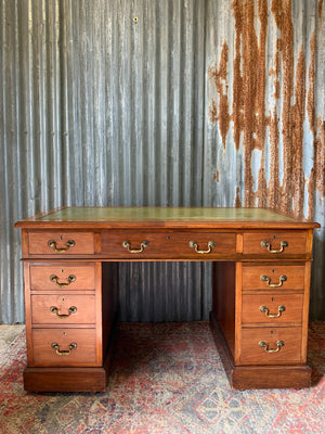 A late Victorian pedestal desk by Maple & Co