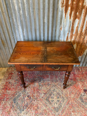 An oak two drawer table