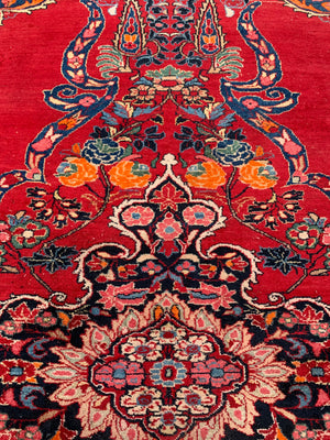 A very large rectangular red ground Persian floral rug ~ 12ft x 8ft