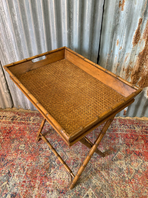 A faux bamboo butler's tray table