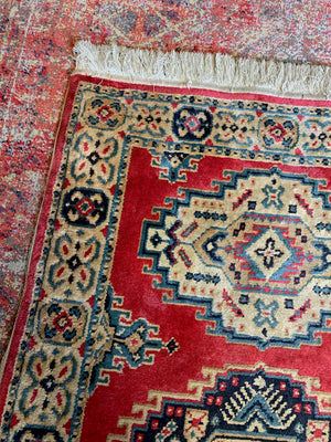 A Persian pink and green ground silk and wool rug ~ 165cm X 92cm