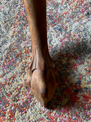 A Georgian style tilt top table with ball and claw feet