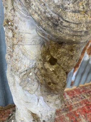 A cast stone garden statue of Guanyin