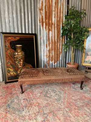 A large Persian carpet footstool